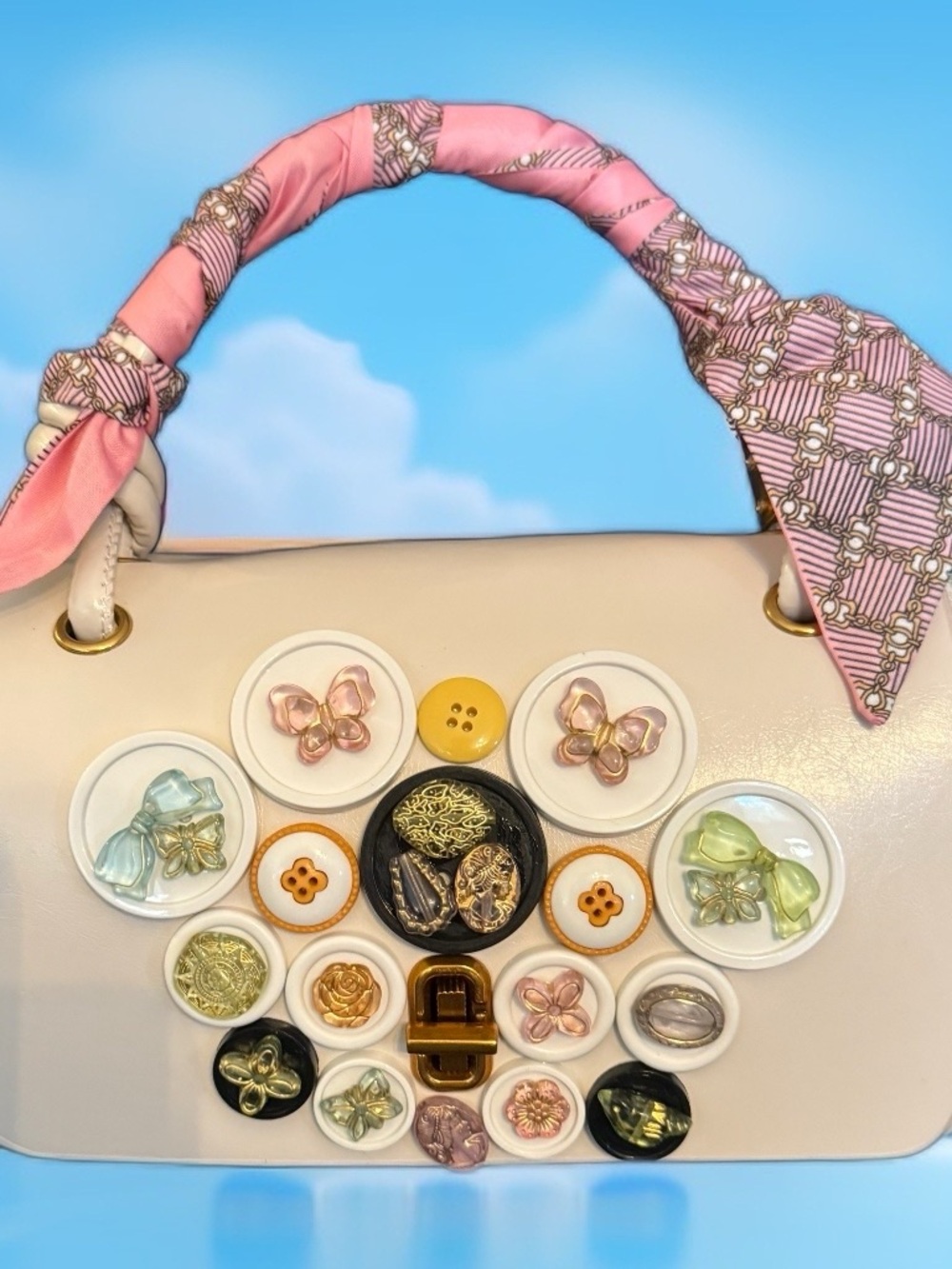 Elegant Cream Shoulder Bag with Pink Scarf Handle